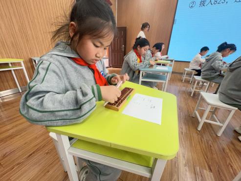 20240411启智珠算节三年级年级赛报道_html_md3758ae.jpg