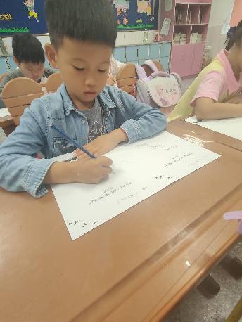 20230914二年级“修补成语墙”活动_html_m163ee13f.jpg