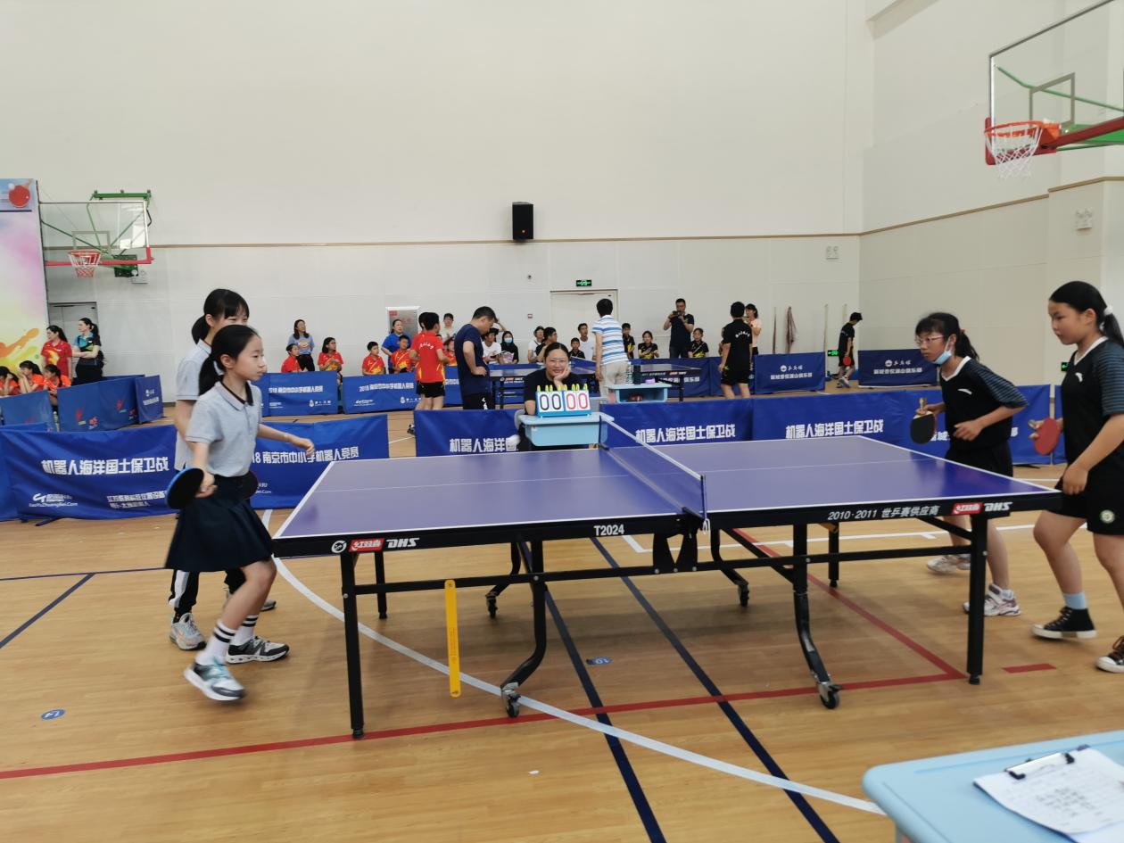 【湖畔光影】赛热情，展风采——记金陵小学（仙林湖校区）校级乒乓球队参加栖霞区小学生乒乓球比赛_html_71dd8207.jpg